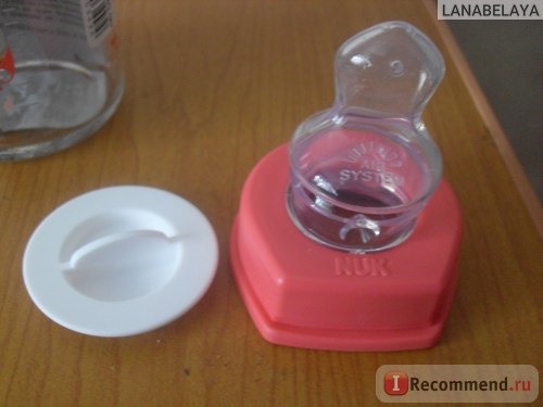 Бутылочка для кормления Nuk Стеклянная 230 мл с силиконовой соской с воздушным клапаном фото